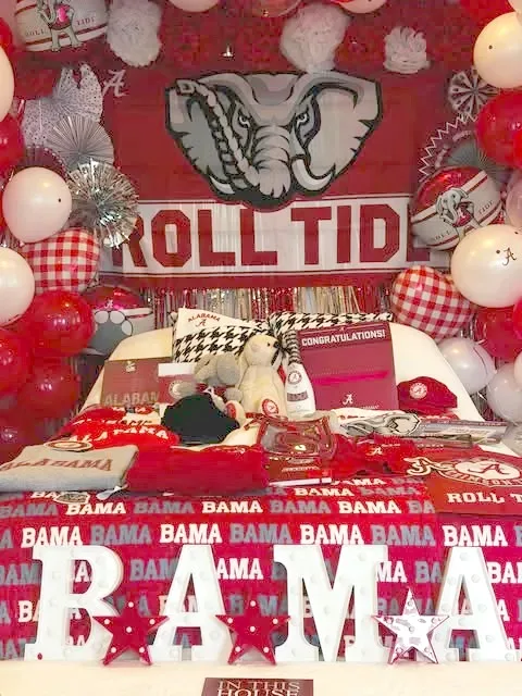 Alabama Roll Tide college bed party with crimson balloons, marquee letters and school-spirit bedding