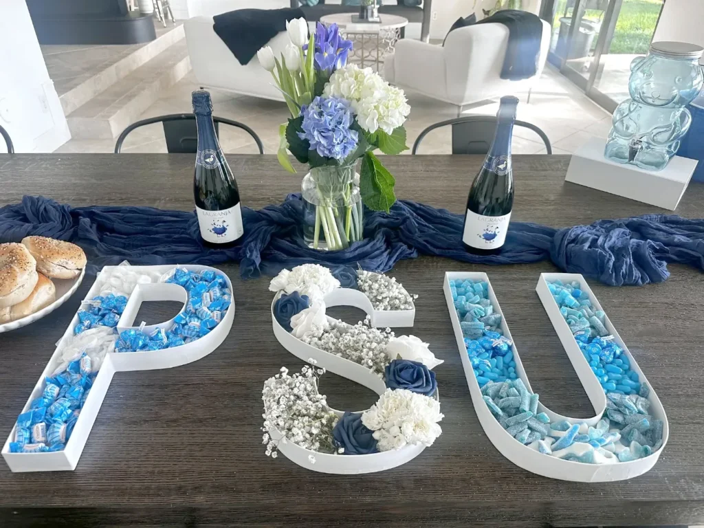 PSU celebration tablescape with flower-filled P, S and U letters on a dining table